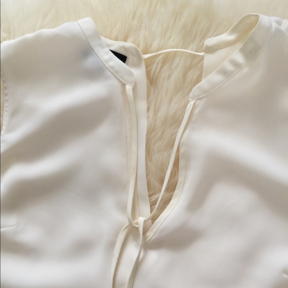 Bebe cream blouse size medium